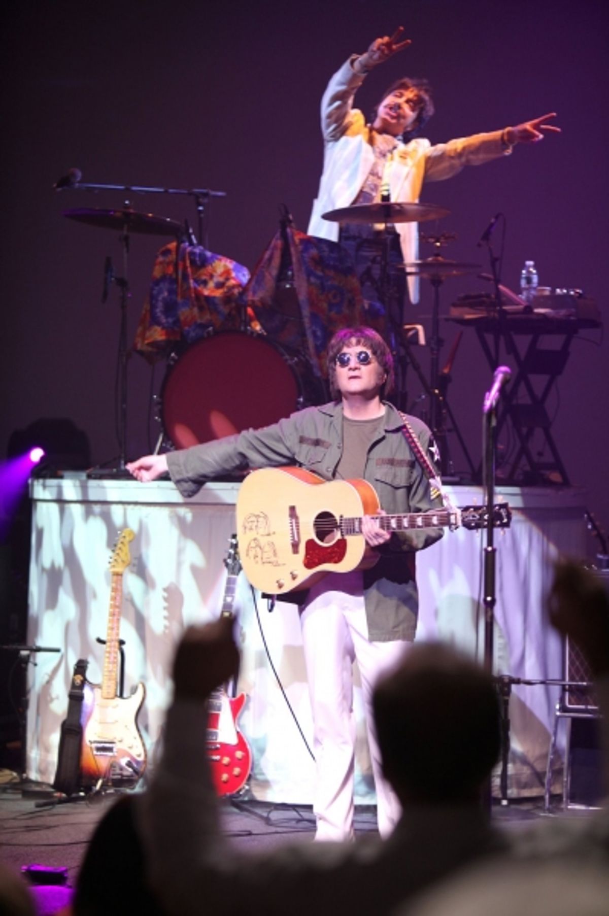 Steve Landes as John Lennon  at 