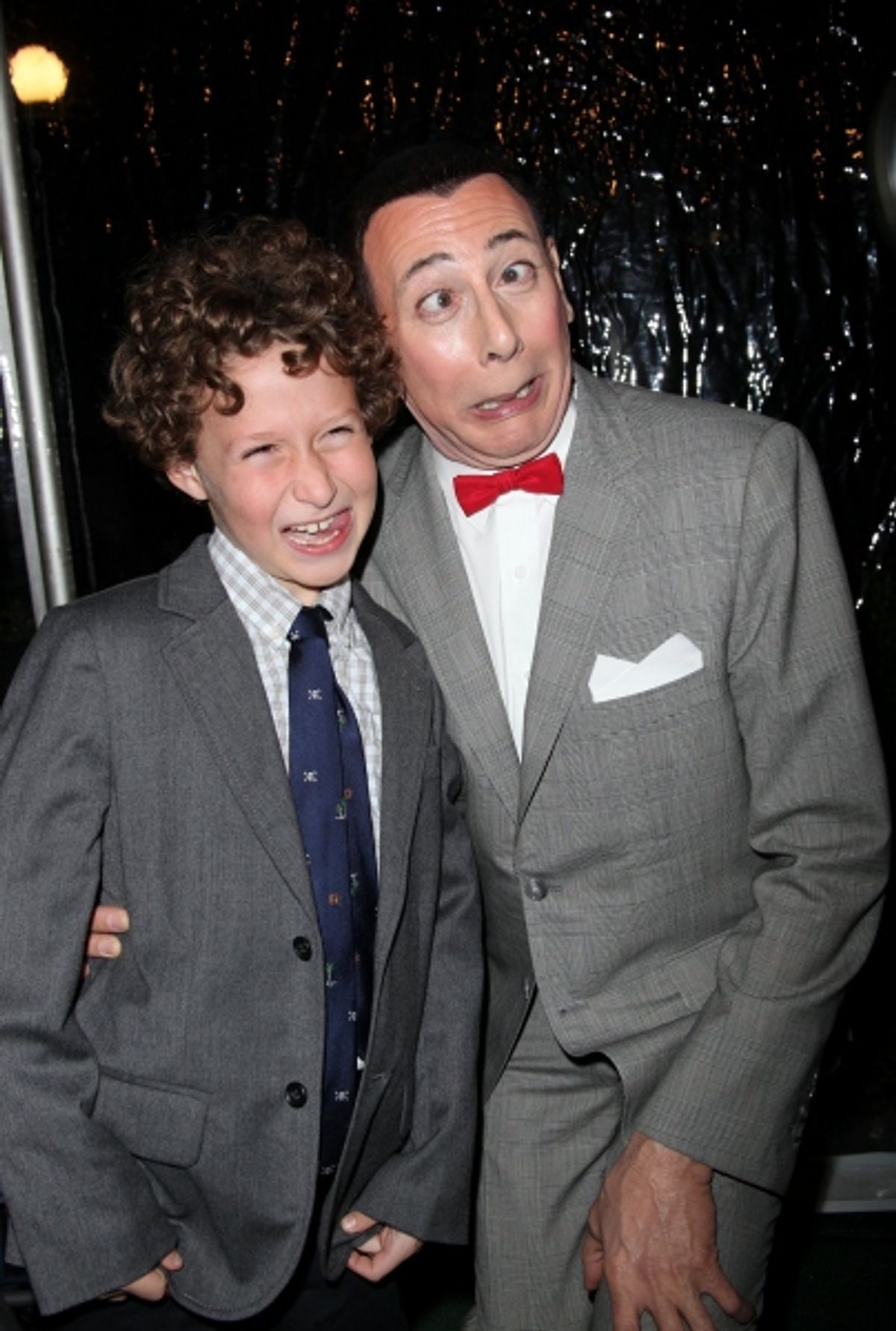 Paul Reubens as Pee-Wee Herman with a young fan at 
