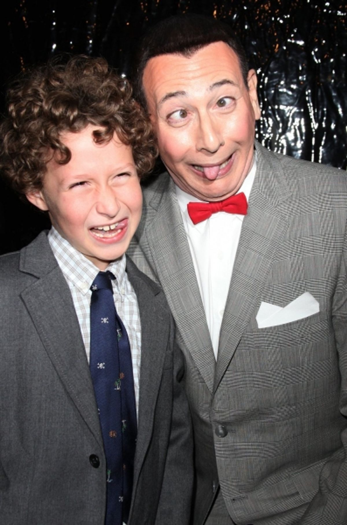 Paul Reubens as Pee-Wee Herman with a young fan at 