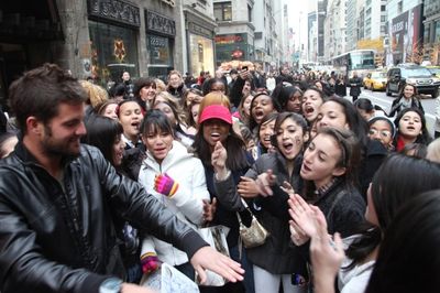 Fans participate in a Justin Bieber Sing-a-Long Photo