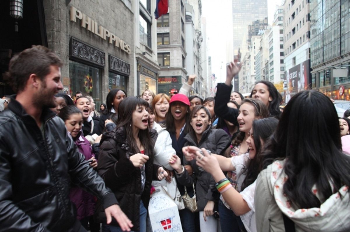 Fans participate in a Justin Bieber Sing-a-Long at 
