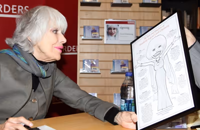 Fan Mr. Carley with his gift for Carol Channing Photo