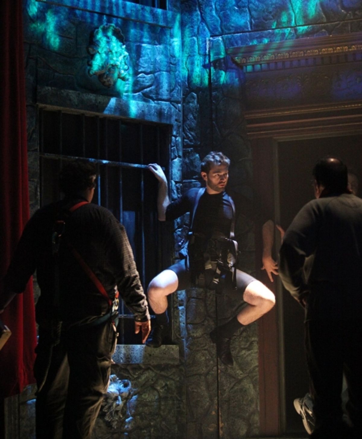 John Buffalo Mailer is practicing wall climb during the Tech Rehearsal at 