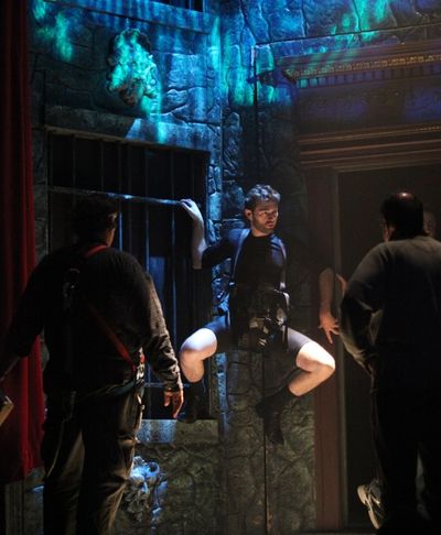 John Buffalo Mailer is practicing wall climb during the Tech Rehearsal Photo