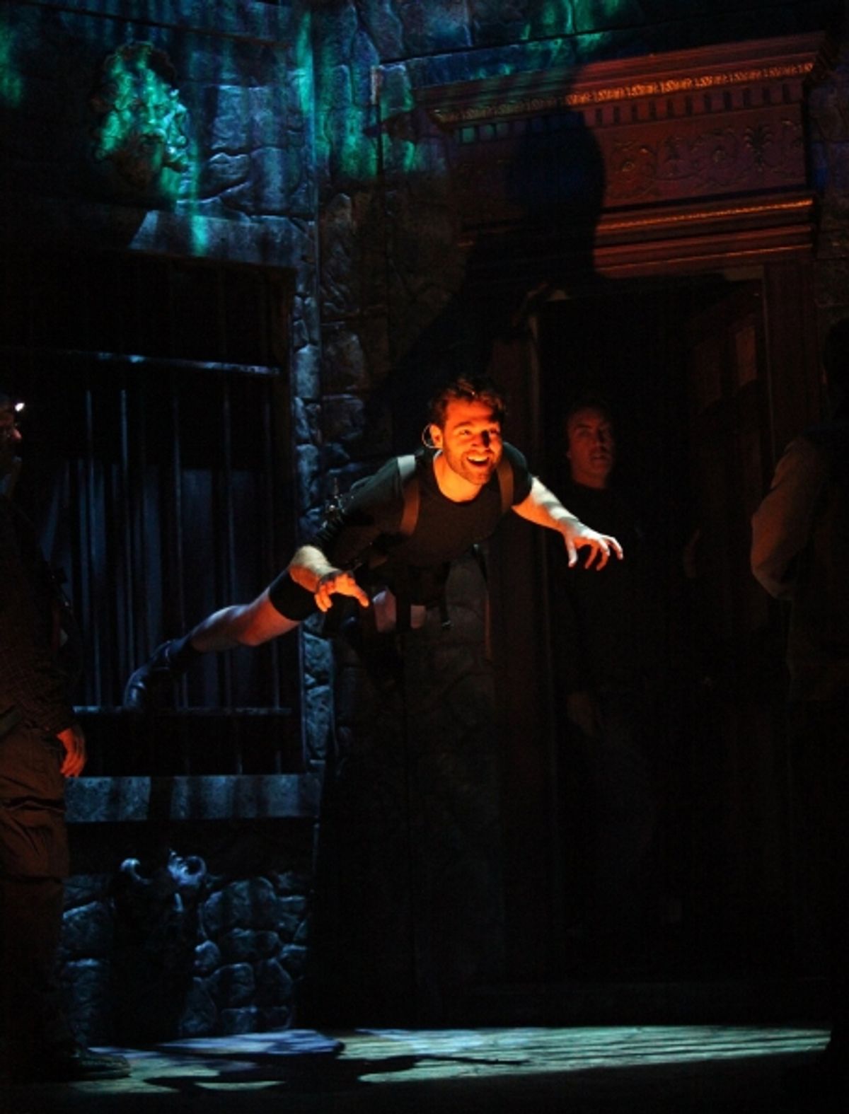 John Buffalo Mailer is practicing wall climb during the Tech Rehearsal at 