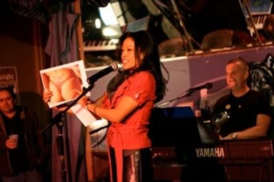 J Elaine Marcos auctions off a photo Photo