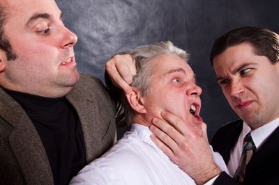 Sporty (Anthony Tournis), and the Commissioner (Eric Paskey) interrogate Bertozzzo (V Photo