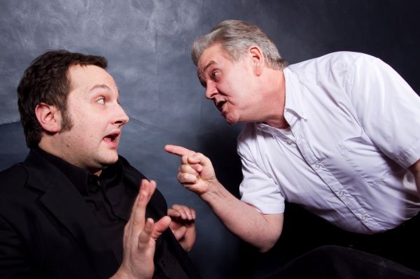 (left to right) The Madman (Joseph Sterns) and Bertozzo (Vincent Lonergan) argue over Photo