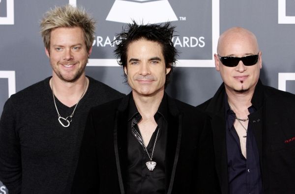  Scott Underwood, Rob Hotchkiss, and Jimmy Stafford of the band Train pictured at The Photo