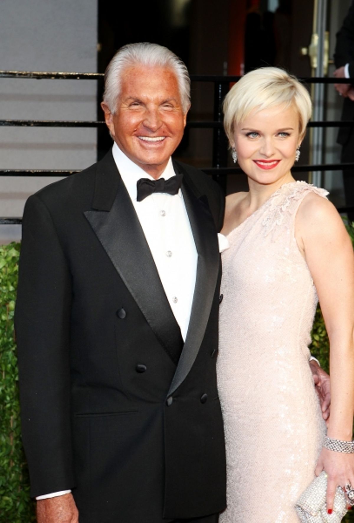 George Hamilton and Barbara Sturm pictured at The Vanity Fair Oscar Party at Sunset Tower Hotel in Los Angeles, CA February 27, 2011. Ã‚Â© RD/ Erik Kabik/ Retna Digital at 