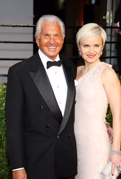 George Hamilton and Barbara Sturm pictured at The Vanity Fair Oscar Party at Sunset T Photo