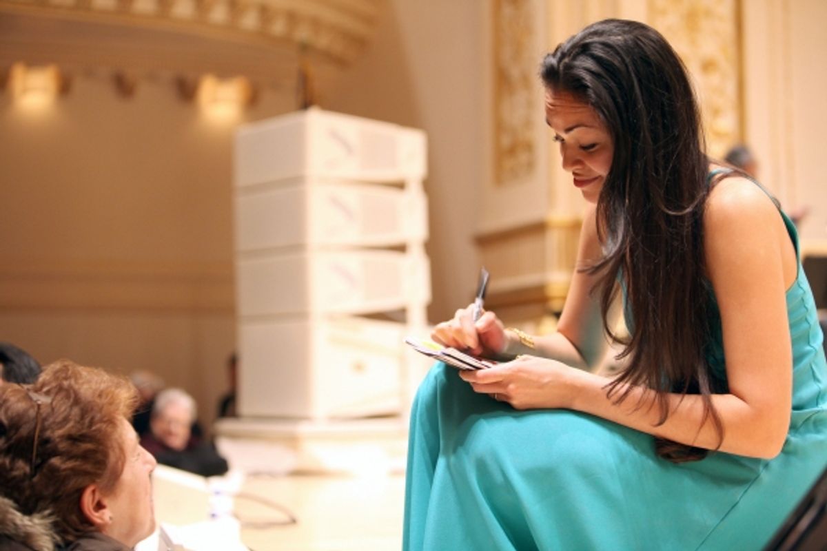 Karen Olivo signs an autograph at the  Open Rehearsal and Concert Performance of The New York PopsÃ�'â€¢ The Great Judy Garland Ã�'Â a one-night-only, song-for-song recreation of GarlandÃ�'â€¢s historic 1961 performance at Carnegie Hall in New York City. at 