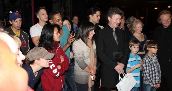 Director Simon Phillips with the ensemble cast viewing video Greetings at the Broadwa Photo