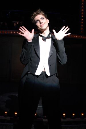 Leo Ash Evens as the Emcee Photo