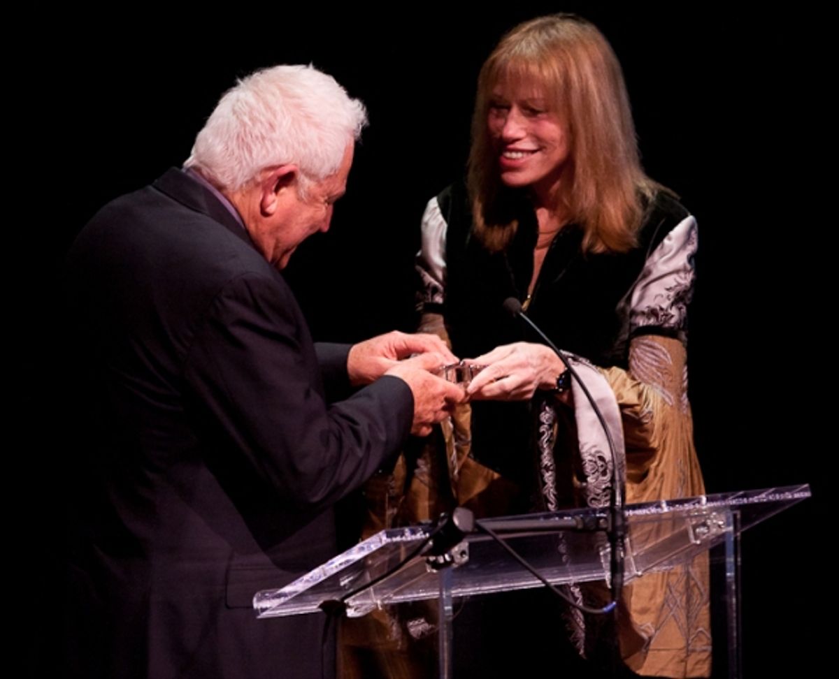 David Seidler accepts his award from Carly Simon at 