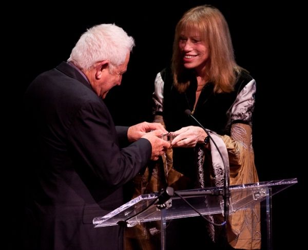 David Seidler accepts his award from Carly Simon Photo