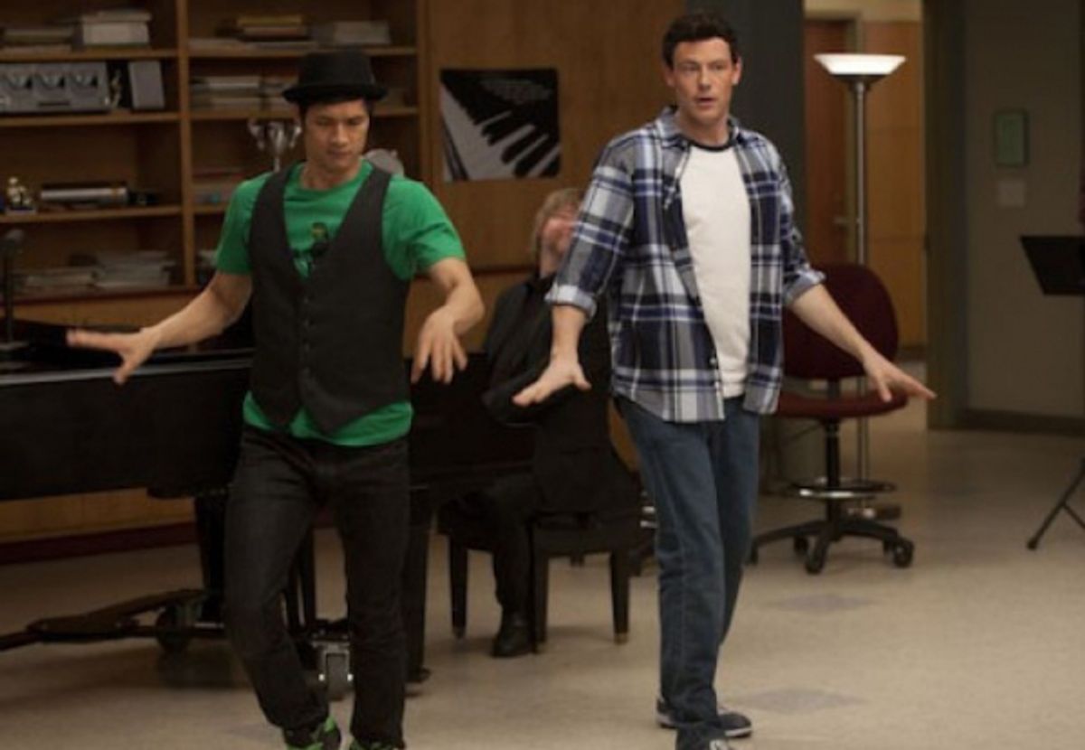 Mike (Harry Shum Jr., L) and Finn (Cory Monteith, R) perform at 