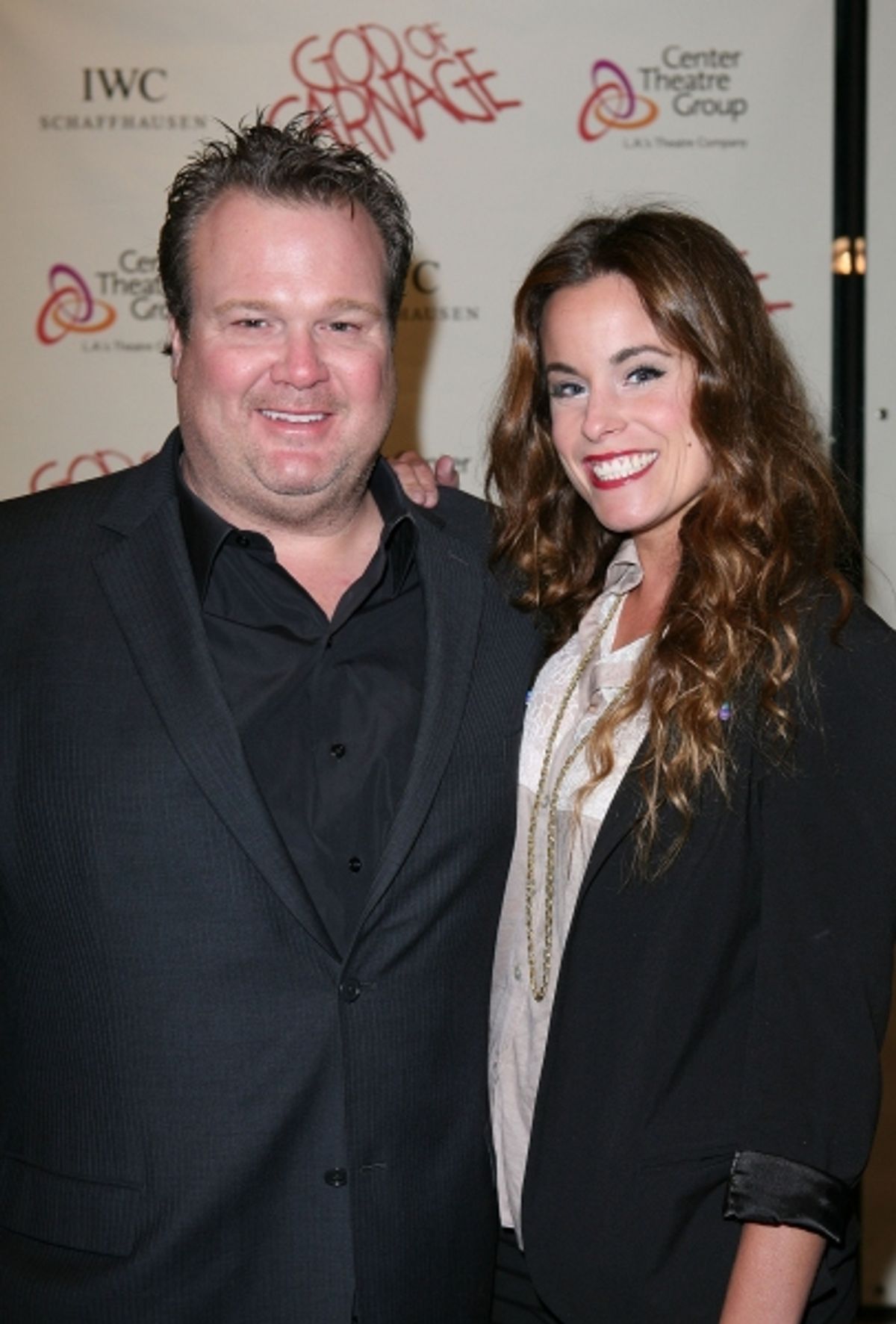 LOS ANGELES, CA - APRIL 13: Actors Eric Stonestreet (L) and Katherine Tokarz (R) pose during the arrivals for the opening night performance of 'God of Carnage' at Center Theatre Group's Ahmanson Theatre on April 13, 2011 in Los Angeles, California. (Photo at 