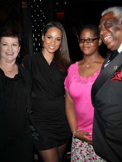 Terria Joseph & daughter Alicia Keys with Woodie King Jr. attending the Woodie King J Photo
