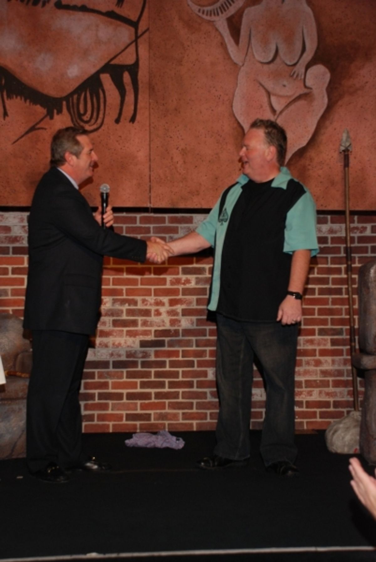 HarrahÃ¢â‚¬â„¢s President Rick Mazer congratulating Caveman star Kevin Burke at 