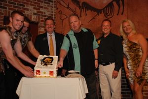Caveman assistants, Harrah’s President Rick Mazer, and Caveman producer John Bentham with the celebratory cake @ BroadwayWorld Caveman assistants, Harrah’s President Rick Mazer, and Caveman produ Photo