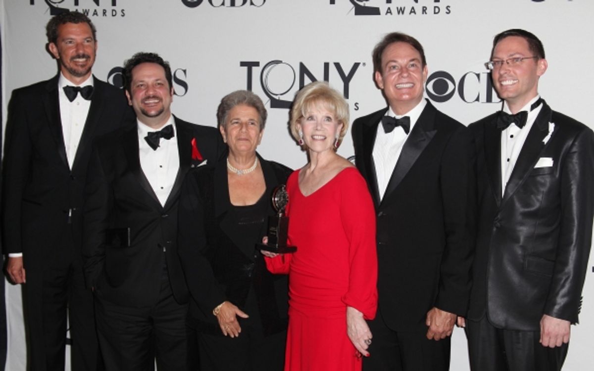 Daryl Roth and fellow producers pose with the award for Best Revival of a Play ' The Normal Heart' in the Press Room at The 65th Annual Tony Awards in New York City.  at 
