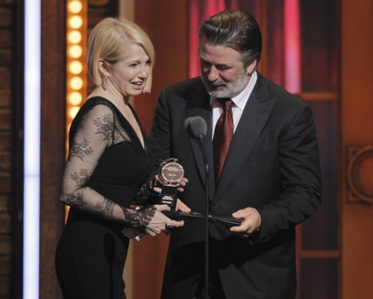 Ellen Barkin reacts after receiving the award for best performance by an actress in a featured role in a play for 'The Normal Heart' from presenter Alec Baldwin, during the American Theatre Wing's 65th annual Tony Awards ceremony in New York, June 12, 201 at 