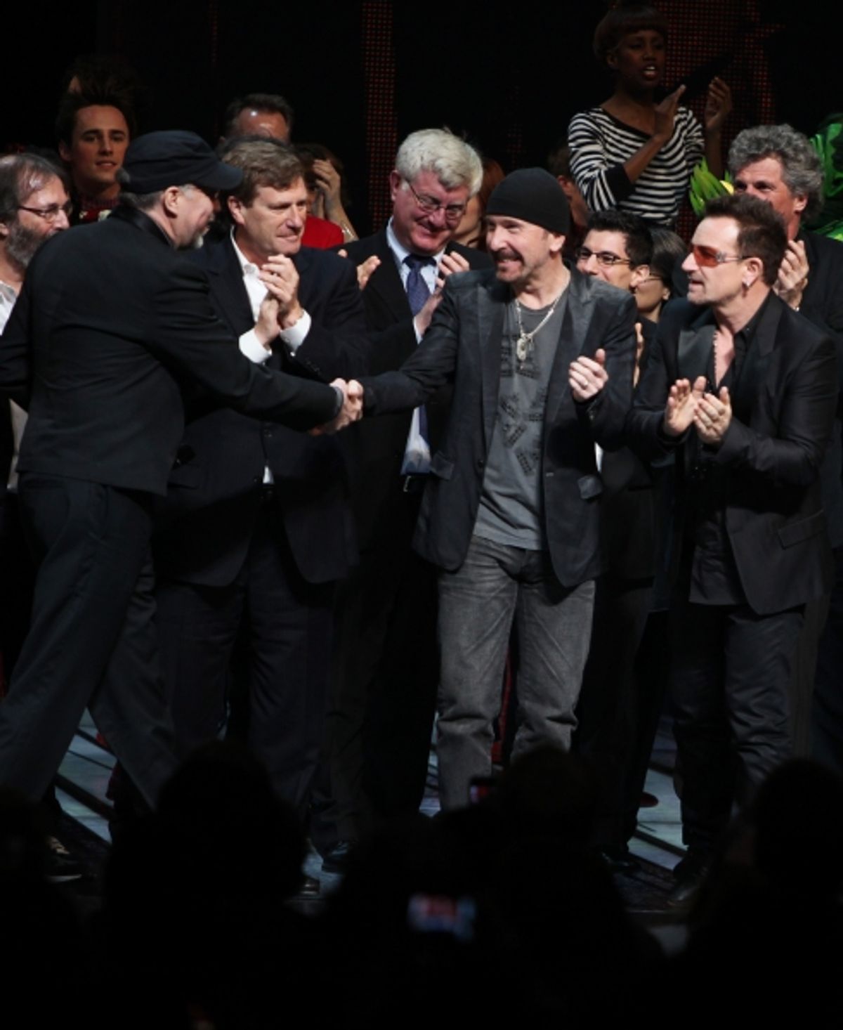 Philip William McKinley (Director) , The Edge and Bono  with the ensemble company during the ''Spider-Man Turn off the Dark'' Opening Night Curtain Call in New York City.  at 