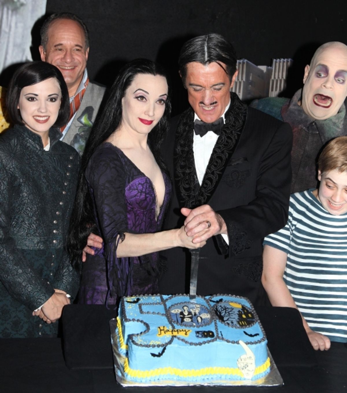 (L-R) Rachel Potter, Adam Grupper, Bebe Neuwirth, Roger Rees, Brad Oscar, Adam Riegler with the cast of 'The Addams Family' celebrating their 500th performance with a special cake-cutting backstage at the Lunt Fontanne Theatre in New York City.  at 