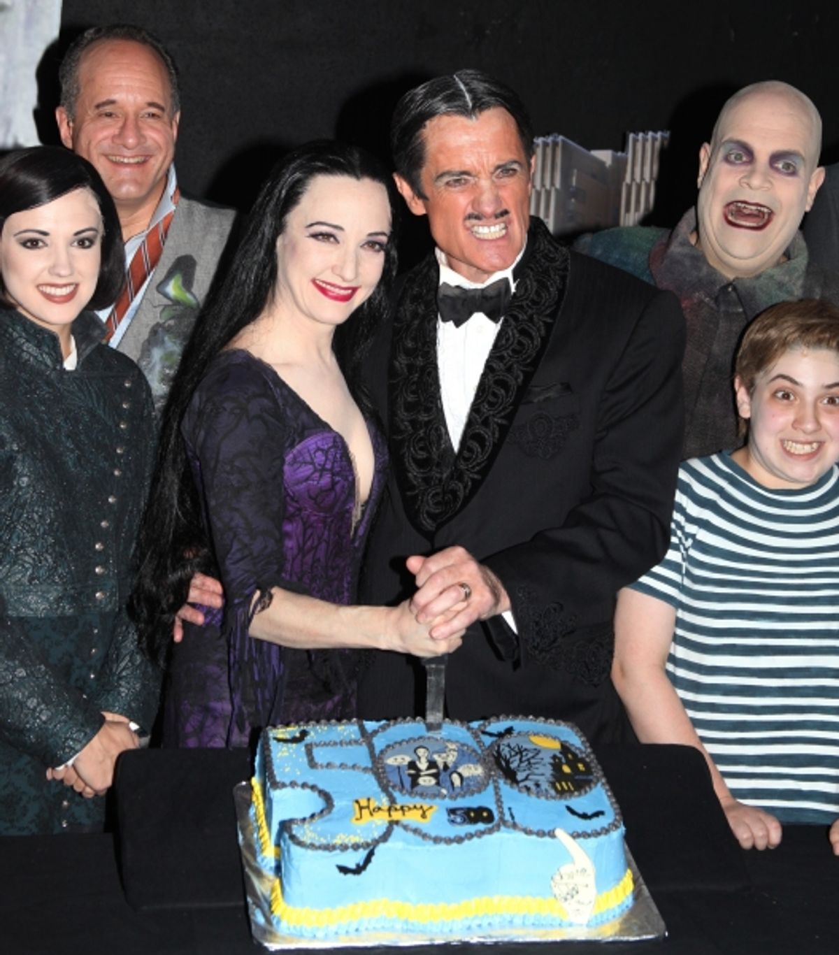 (L-R) Rachel Potter, Adam Grupper, Bebe Neuwirth, Roger Rees, Brad Oscar, Adam Riegler with the cast of 'The Addams Family' celebrating their 500th performance with a special cake-cutting backstage at the Lunt Fontanne Theatre in New York City.  at 