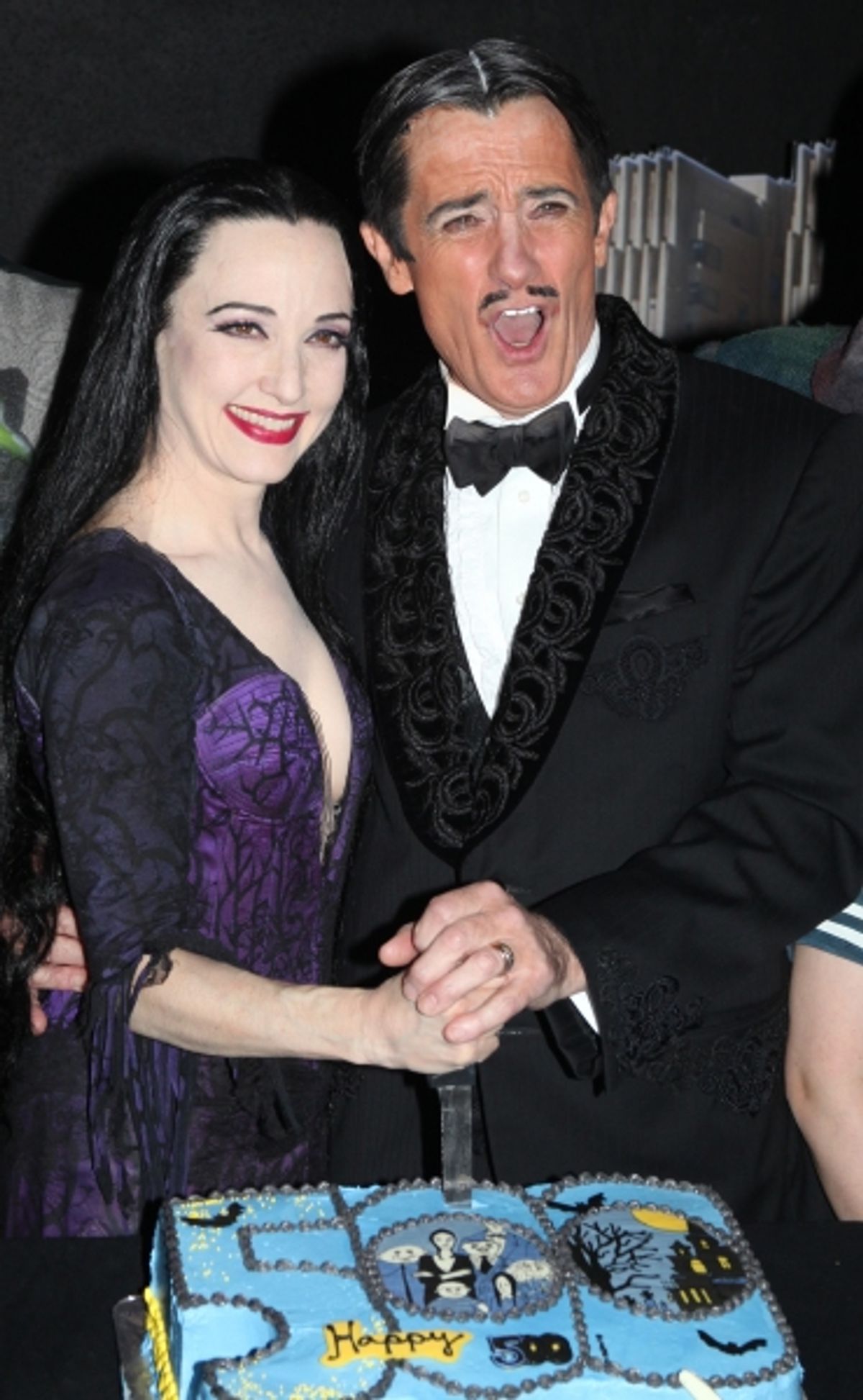 Bebe Neuwirth & Roger Rees with the cast of 'The Addams Family' celebrating their 500th performance with a special cake-cutting backstage at the Lunt Fontanne Theatre in New York City.  at 