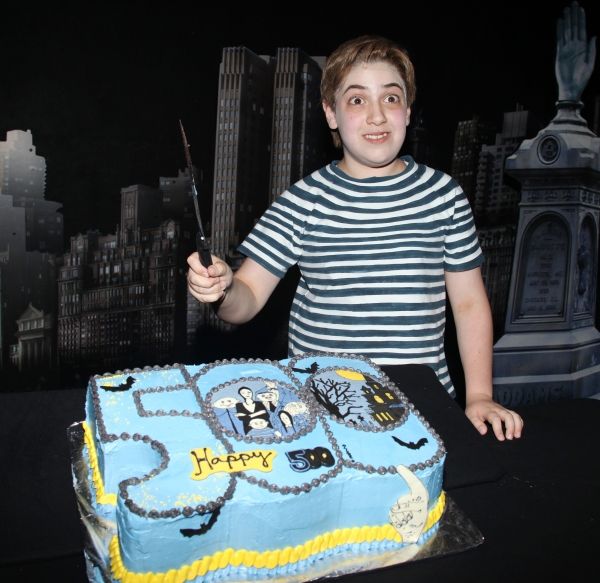 Adam Riegler with the cast of 'The Addams Family' celebrating their 500th performance Photo