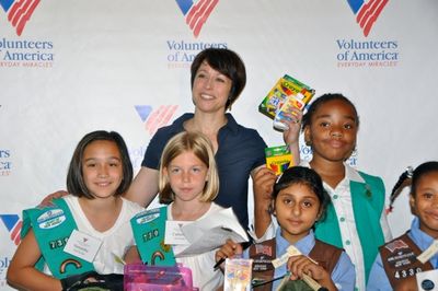 Paige Davis and Local Girl Scouts help fill backpacks Photo