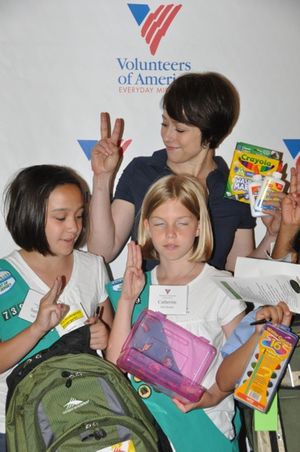 Paige Davis and Local Girl Scouts help fill backpacks Photo