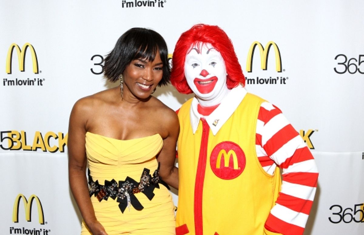 365Black Awards Co-host Angela Bassett poses with Ronald McDonaldÃ‚Â® on the red carpet. Angela Bassett and radio legend Tom Joyner hosted the 2011 365Black Awards in New Orleans during Essence Music Festival. at 
