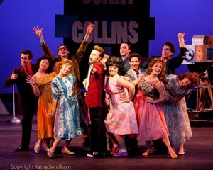 Matthew Ryan Thompson as Corny Collins, Brittany Lynne Eckstrom as Tracy Turnblad, and the Corny Collins Council @ BroadwayWorld Matthew Ryan Thompson as Corny Collins, Brittany Lynne Eckstrom as Tracy Turnblad, an Photo