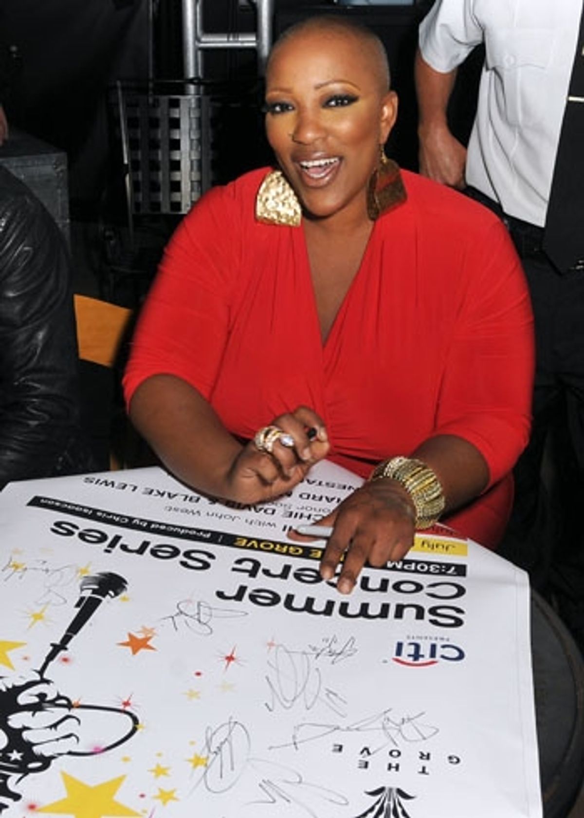 Frenchie Davis signs posters after her performance at The Grove Summer Concert Series at 