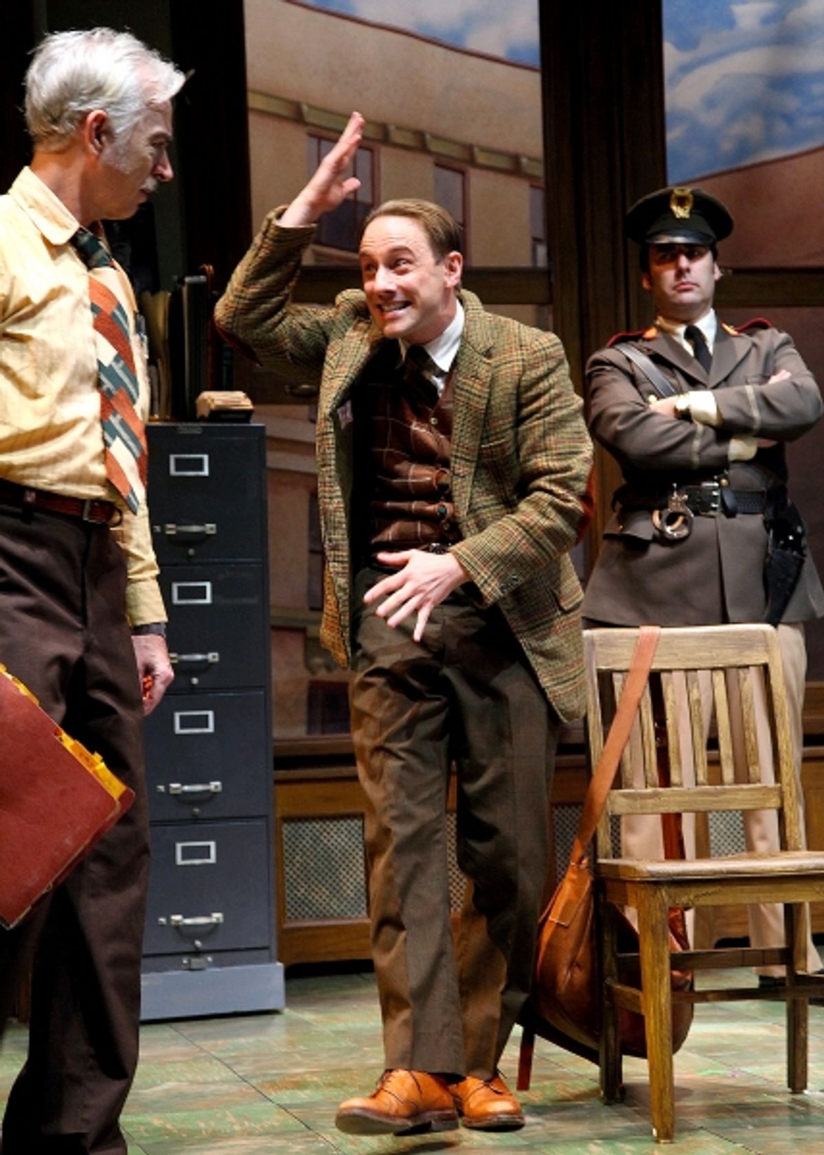 Kevin Isola as the Maniac is interrogated by Inspector Bertozzo, played by Philip Goodwin (left) and the Constable, played by Jeffrey M. Bender  at 