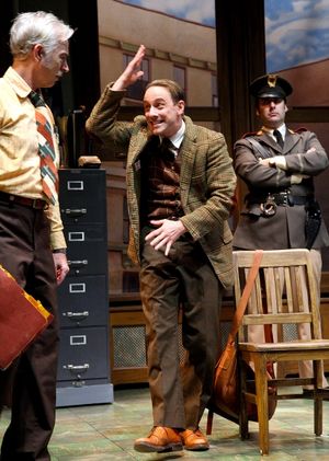 Kevin Isola as the Maniac is interrogated by Inspector Bertozzo, played by Philip Goodwin (left) and the Constable, played by Jeffrey M. Bender @ BroadwayWorld Kevin Isola as the Maniac is interrogated by Inspector Bertozzo, played by Philip Goo Photo