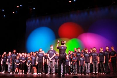 Paul Canaan conducts the cast of "True Colors"
 Photo