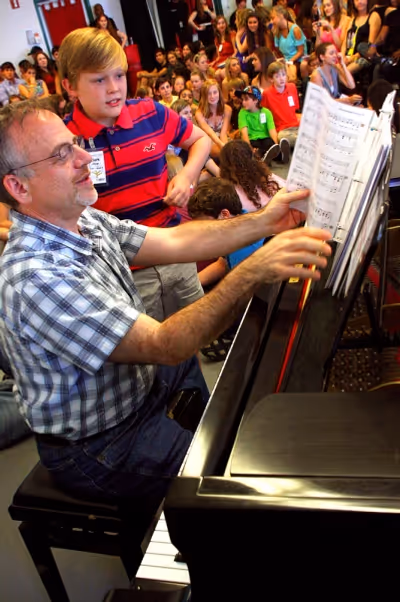 Marc Shaiman accompanies a student Photo