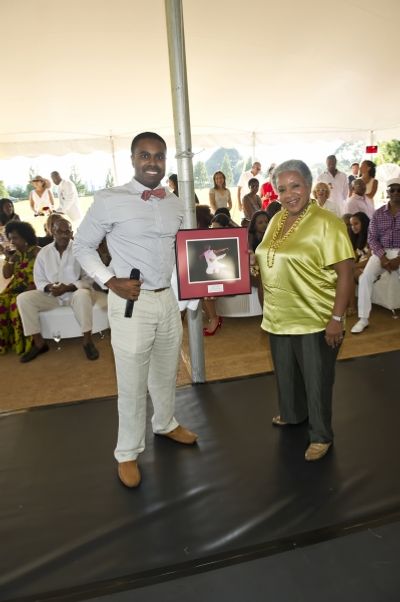 Dr. Ancy Verdier presents Lola C. West with her award Photo