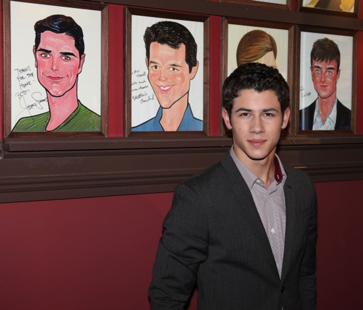 Nick Jonas announces he will star in the Broadway Musical 'How To Succeed in Business without Really Trying' starting January 24, 2012 at the Al Hirschfeld Theatre in New York City.. Seen here with Portraits of past actors who has starred in his role. at 