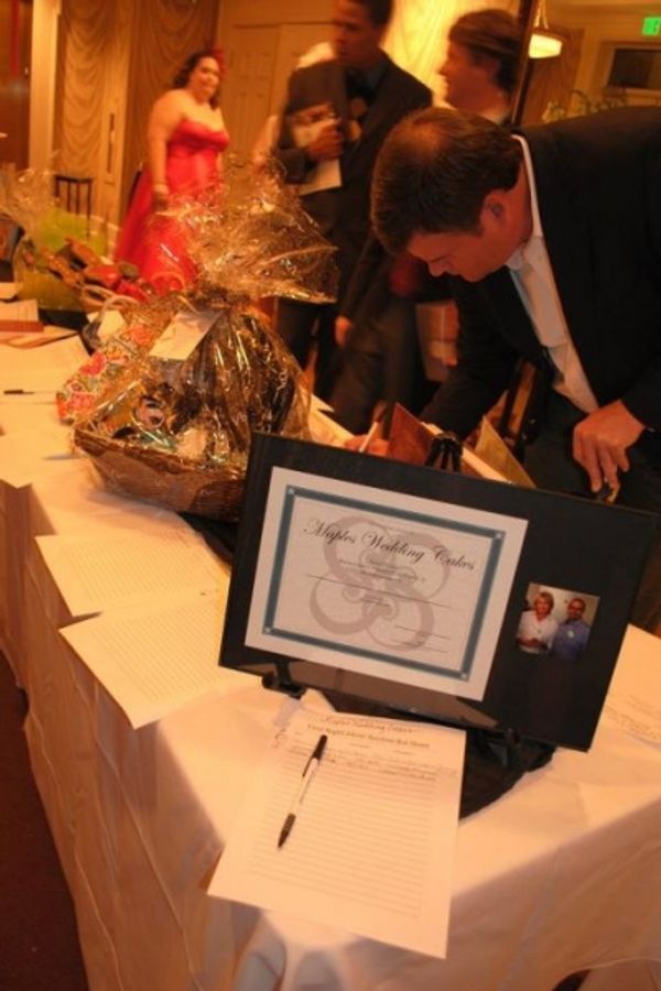 Chris McKee makes a bid during the silent auction Photo