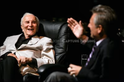 Kirk Douglas (L) talks on stage with CTG Artistic Director Michael Ritchie 
 Photo