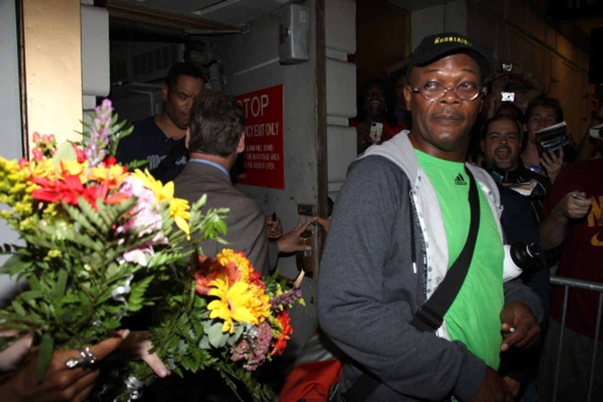 Samuel L. Jackson receives flowers from a fan at 