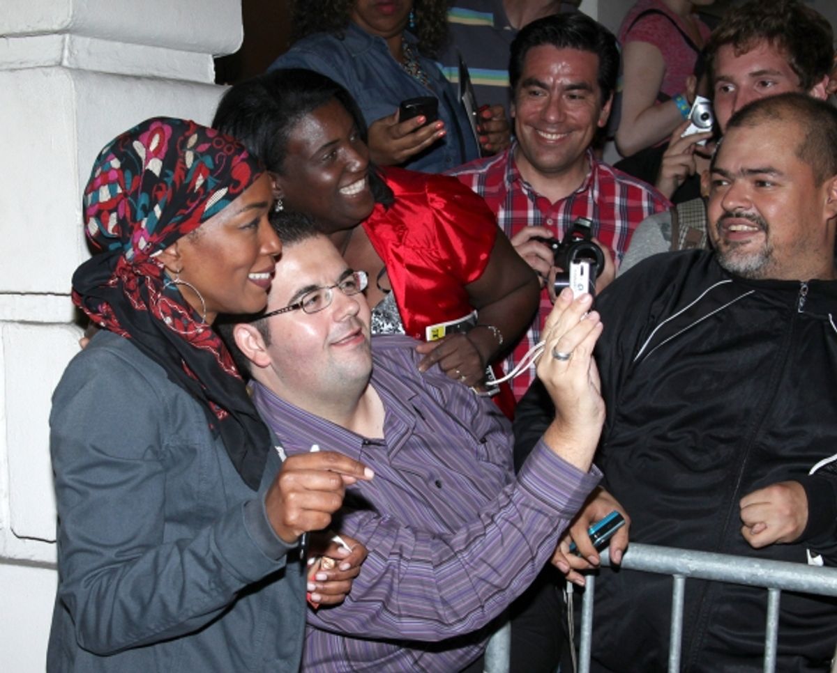 Angela Bassett poses with fans at 