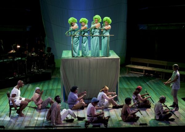 Alvin Crawford as Odysseus (left), the Globe Guilders as the Sirens (top) and the cas Photo
