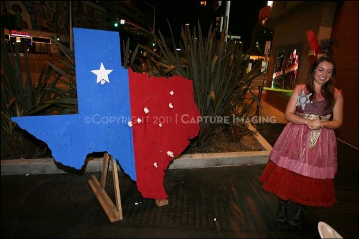 CULVER CITY, CA - OCTOBER 8: CTG concierge Laura Cheek runs a game during the shindig for the opening night performance of 'I've Never Been So Happy' at Center Theatre Group's Kirk Douglas Theatre on October 8, 2011 in Culver City, California. (Photo by R at 