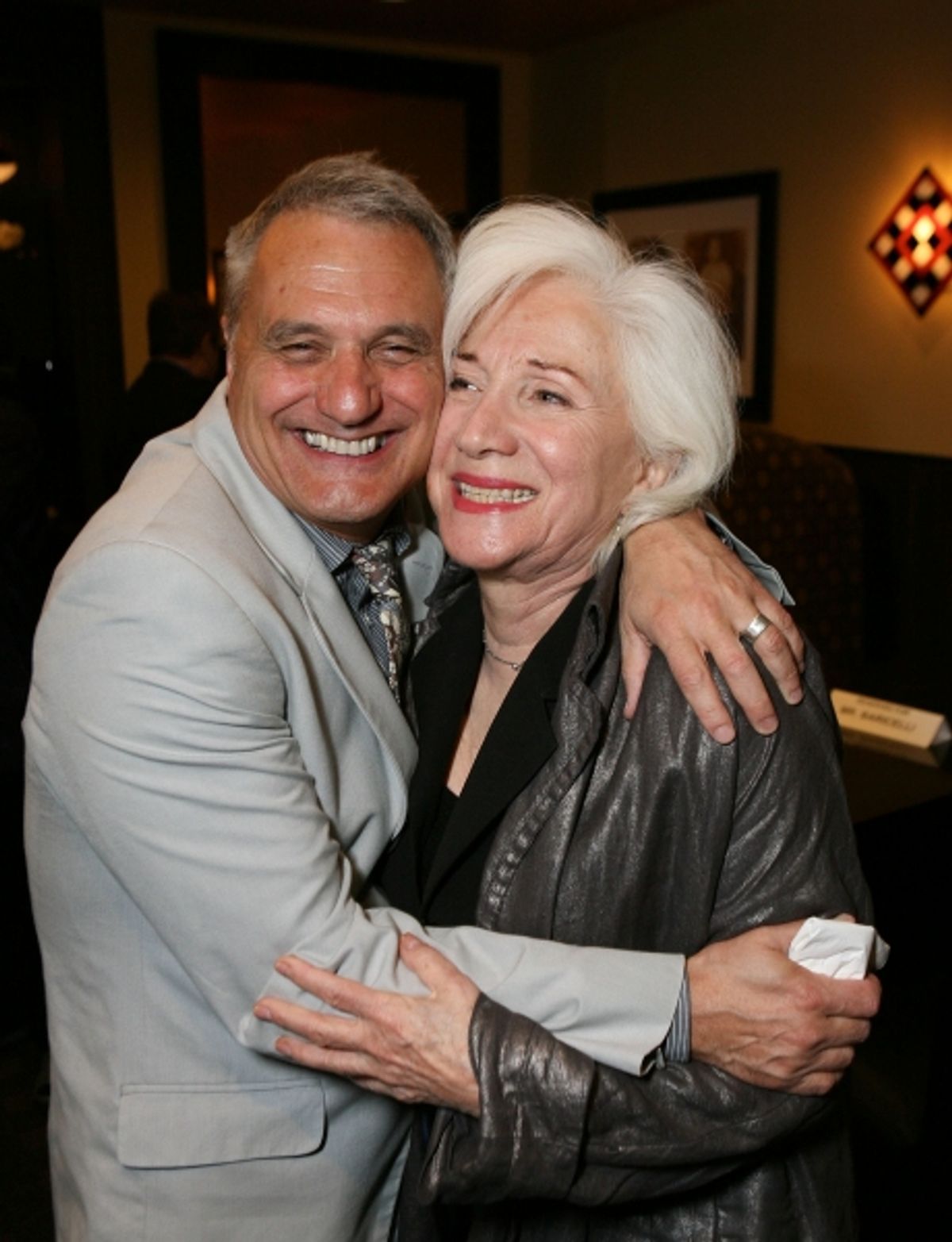 LOS ANGELES, CA - NOVEMBER 6: Writer/Director Morris Panych (L) and cast member Olympia Dukakis (R) hug during the party for the opening night performance of 'Vigil' at Center Theatre Group's Mark Taper Forum on November 6, 2011 in Los Angeles, California at 